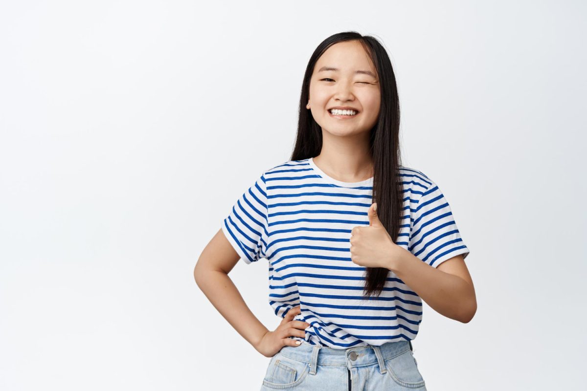 woman thumbs up for psle tuition